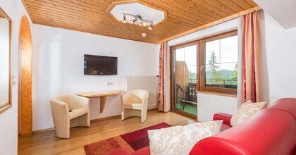 Zimmer mit Sitzgelegenheit